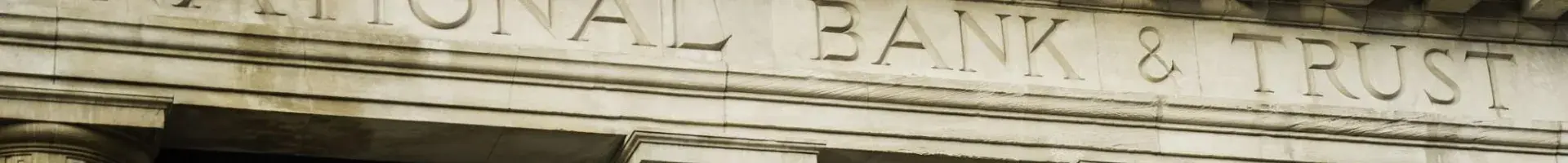 The Outside of a Bank Building with the Name of the Bank on the Front of the Building
