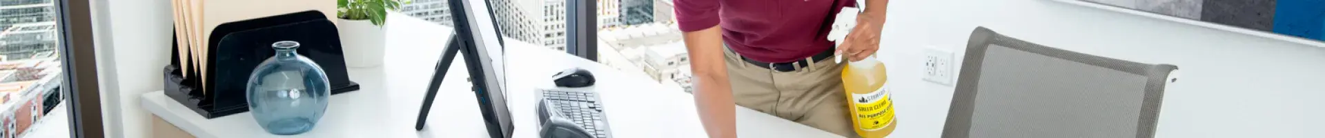 Collage of a Hand Holding a Bottle of Stratus Cleaner, a Worker with a Broom, Outside of a Building, and a Green Seal Logo