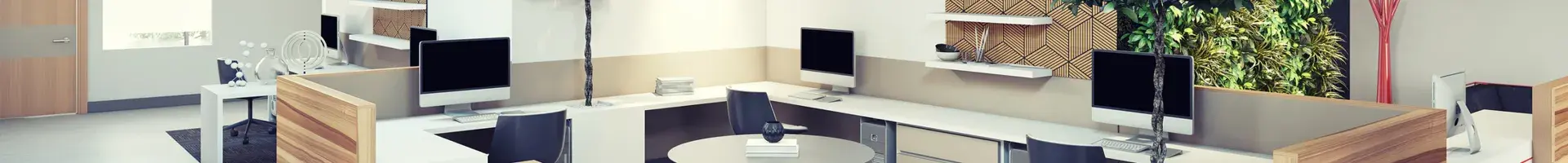 An Office with Multiple Desks, Desk Chairs, and Cubicles